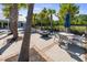 Outdoor lounge area featuring modern seating, a fire pit, and shade umbrellas, creating a relaxing and social space at 209 Hayworth Rd, Summerville, SC 29486