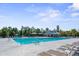 Resort-style pool with lounge chairs, splash pad, and covered seating area, perfect for relaxation and summer fun at 209 Hayworth Rd, Summerville, SC 29486