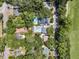 Aerial view of neighborhood homes featuring pools and lush green trees at 2142 Golfview Dr, Charleston, SC 29412