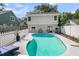 Backyard pool featuring an elegant design, a lounge chair, and a meticulously maintained lawn at 2142 Golfview Dr, Charleston, SC 29412