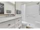 Clean bathroom with marble vanity, tiled shower, and modern fixtures at 2142 Golfview Dr, Charleston, SC 29412