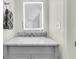 Well-lit bathroom with vanity, a stylish mirror, and neutral walls at 2142 Golfview Dr, Charleston, SC 29412