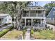 Charming two-story home with double porches, manicured lawn, and inviting curb appeal at 2142 Golfview Dr, Charleston, SC 29412