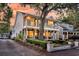 Charming two-story home featuring dual balconies with manicured landscaping and side driveway at 2142 Golfview Dr, Charleston, SC 29412