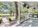 Inviting front porch with hanging plants and peaceful neighborhood views at 2142 Golfview Dr, Charleston, SC 29412