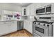 Bright kitchen featuring stainless steel appliances, white cabinetry, and a beautiful window view at 2142 Golfview Dr, Charleston, SC 29412