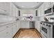 Bright, all-white kitchen featuring modern appliances, sleek countertops, and ample cabinet space, perfect for culinary enthusiasts at 2142 Golfview Dr, Charleston, SC 29412