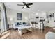 Open-concept living room showcasing hardwood floors and a modern kitchen with stainless steel appliances at 2142 Golfview Dr, Charleston, SC 29412