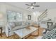 Bright living room featuring a comfortable sofa, decorative pillows, and stylish accents for a cozy and elegant space at 2142 Golfview Dr, Charleston, SC 29412