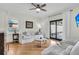Cozy living room with white sofas, hardwood floors, and a view to the outdoor patio at 2142 Golfview Dr, Charleston, SC 29412