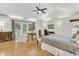 Bright main bedroom featuring hardwood floors, a vaulted ceiling, and a private balcony at 2142 Golfview Dr, Charleston, SC 29412