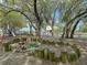 -friendly playground features a sandbox, climbing structures, and play equipment, set among large shade trees at 2142 Golfview Dr, Charleston, SC 29412