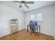 Bedroom featuring wood floors, a desk with computer, ergonomic chair, shelf, and overhead fan at 2174 Bees Ferry Rd # G, Charleston, SC 29414