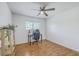 Bright bedroom with hardwood floors, a ceiling fan, desk, chair, and window with natural light at 2174 Bees Ferry Rd # G, Charleston, SC 29414
