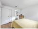 Bedroom showcasing hardwood floors and a doorway to a private ensuite bathroom at 2174 Bees Ferry Rd # G, Charleston, SC 29414