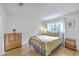 Serene bedroom featuring a metal bed frame, hardwood floors, and tranquil natural light at 2174 Bees Ferry Rd # G, Charleston, SC 29414
