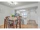 Dining area with table and chairs adjacent to the kitchen featuring white cabinets and a butcher block countertop at 2174 Bees Ferry Rd # G, Charleston, SC 29414
