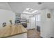 Kitchen featuring white cabinets, wooden countertops, and stainless appliances under a skylight at 2174 Bees Ferry Rd # G, Charleston, SC 29414
