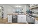 Kitchen featuring white cabinets and a butcher block countertop overlooking a living room area at 2174 Bees Ferry Rd # G, Charleston, SC 29414