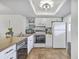 Kitchen with white cabinets, tiled flooring, a butcher block countertop, and stainless steel appliances at 2174 Bees Ferry Rd # G, Charleston, SC 29414