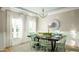 Elegant dining room featuring a modern chandelier, large windows, and stylish decor at 219 Callibluff St, Summerville, SC 29486