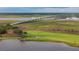 Picturesque aerial view of a golf course and a bridge with boats docked along the water at 2217 Ramsay St, Charleston, SC 29412