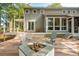 Inviting outdoor deck with a stone fireplace and patio furniture at 2217 Ramsay St, Charleston, SC 29412
