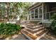 This charming deck is perfect for relaxing and enjoying the beautifully landscaped backyard at 2217 Ramsay St, Charleston, SC 29412