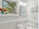 Bathroom with a beautiful marble sink and a painting that adds a touch of character and charm at 2217 Ramsay St, Charleston, SC 29412