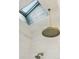 Bright bathroom featuring a skylight above a modern rainfall shower and tiled walls at 2217 Ramsay St, Charleston, SC 29412