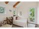 Bright bedroom featuring a bed, a window, and a door leading to a private balcony at 2217 Ramsay St, Charleston, SC 29412