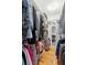 Well-organized walk-in closet with ample storage and a display case at 2217 Ramsay St, Charleston, SC 29412