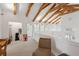 Upstairs hallway with vaulted ceilings, exposed beams, and a cozy seating area at 2217 Ramsay St, Charleston, SC 29412