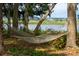 Relax in this hammock between two large trees in the yard, facing the water at 2217 Ramsay St, Charleston, SC 29412