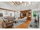 Bright living space flows into the kitchen, featuring hardwood floors, high ceilings, and a beautiful built in at 2217 Ramsay St, Charleston, SC 29412