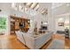 Bright, open living room with exposed beams, fireplace, hardwood floors and custom built-ins at 2217 Ramsay St, Charleston, SC 29412