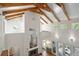 Grand living room featuring vaulted ceilings, exposed beams, and a clear view of the living spaces below at 2217 Ramsay St, Charleston, SC 29412