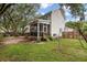 View of backyard featuring a screened porch, mature trees, and ample yard space at 237 Dillard Dr, Goose Creek, SC 29445