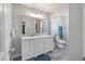 The bathroom is designed with a modern style, featuring a large mirror and vanity storage at 237 Dillard Dr, Goose Creek, SC 29445