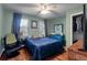 This bedroom features a ceiling fan, closet, and a large window for natural light at 237 Dillard Dr, Goose Creek, SC 29445