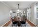 Elegant dining room with wood table, hardwood floors, and modern lighting at 237 Dillard Dr, Goose Creek, SC 29445