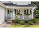 Inviting front porch decorated with plants and a light blue painted front door at 237 Dillard Dr, Goose Creek, SC 29445