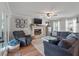 Cozy living room featuring a stone fireplace, large sectional, and natural light at 237 Dillard Dr, Goose Creek, SC 29445