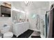 Modern main bathroom boasts dual sinks, a large mirror, a glass shower, and ample storage at 237 Dillard Dr, Goose Creek, SC 29445