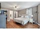 Comfortable main bedroom with hardwood floors, a ceiling fan, two closets, and a large window at 237 Dillard Dr, Goose Creek, SC 29445