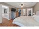 Comfortable main bedroom with hardwood floors, a ceiling fan, three closets, and an en-suite bath at 237 Dillard Dr, Goose Creek, SC 29445