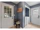 Mud room features a convenient laundry area, shoe rack, and multiple entry points with natural lighting at 237 Dillard Dr, Goose Creek, SC 29445