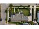 Overhead view of a home with a manicured backyard, patio seating, and mature trees in a neighborhood at 2489 Daniel Island Dr, Daniel Island, SC 29492