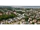 Aerial view of a residential neighborhood, featuring a lake and bridge in the background at 2489 Daniel Island Dr, Daniel Island, SC 29492
