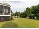 Lush backyard with a patio set and lounge chairs at 2489 Daniel Island Dr, Daniel Island, SC 29492